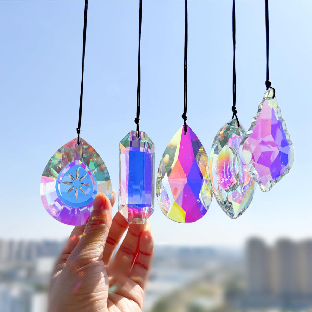 Simneygo 3-inch crystal suncatcher prisms on a window casting vivid rainbows