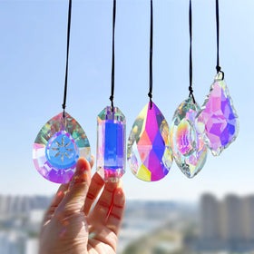 Simneygo 3-inch crystal suncatcher prisms on a window casting vivid rainbows