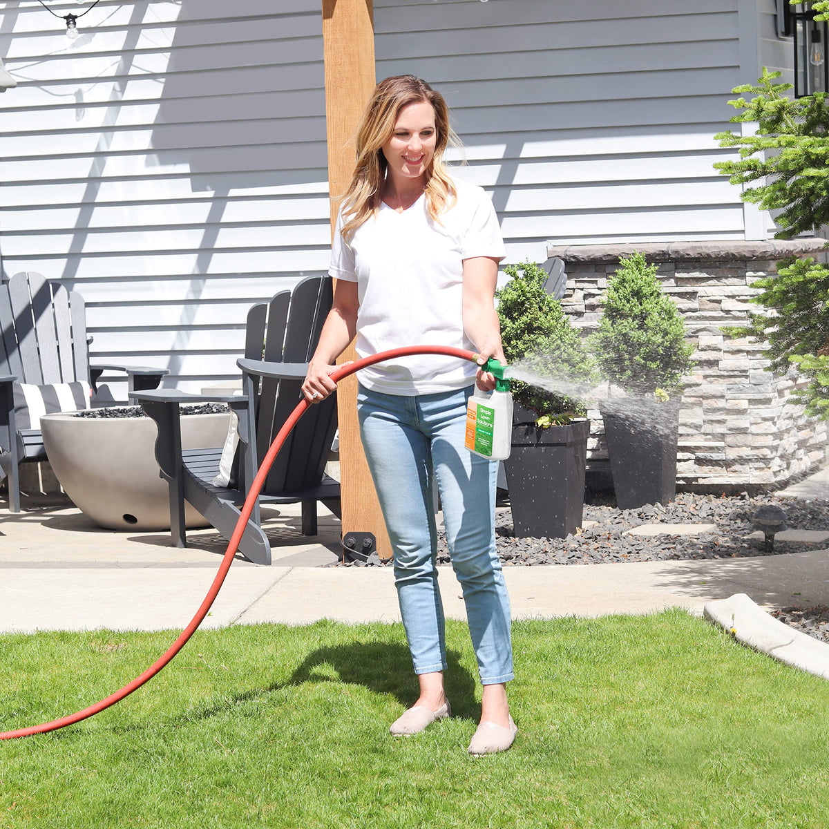 Covers up to 3,200 square feet with attached sprayer.