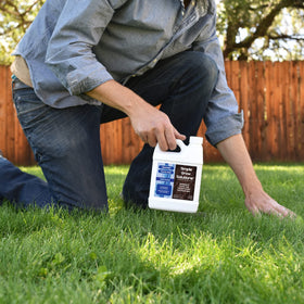 Simple Lawn Solutions Soil Hume sprayer application demonstrates easy hose-end or backpack use for coverage.