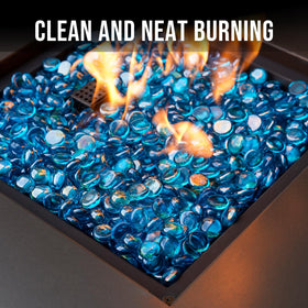 Skyflame Caribbean Blue beads illuminated in a lit fire pit.