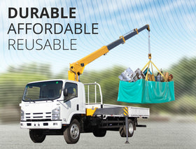 Skywin TidyFriend dumpster bag with reinforced transport handles for hauling.