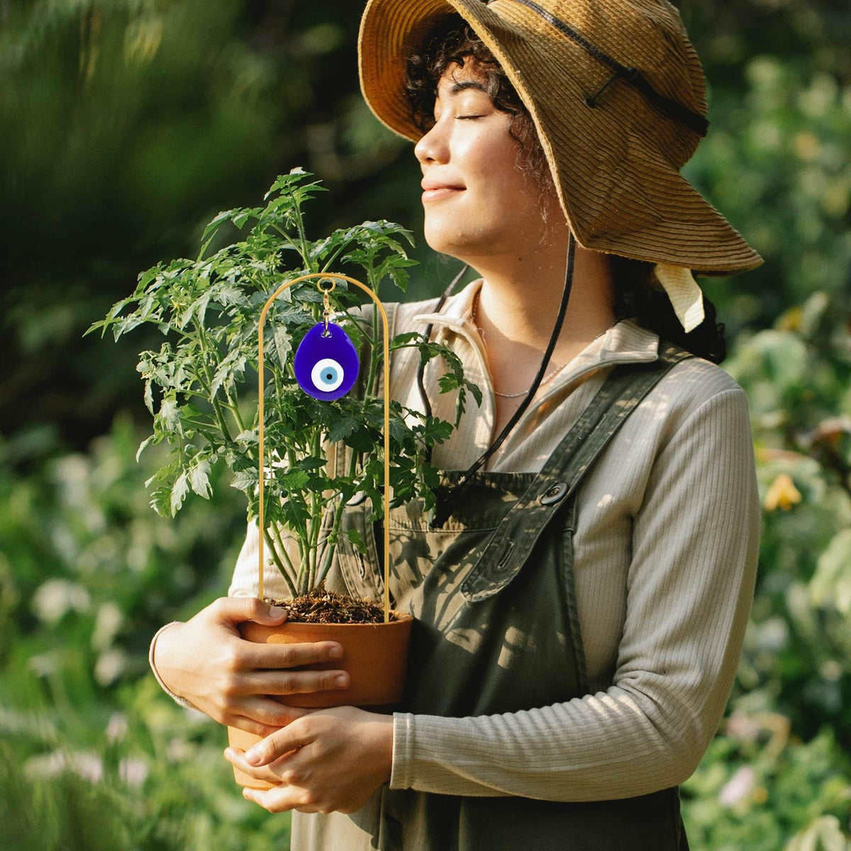 Slepceub decorative garden stake doubles as yard art while supporting ivy and morning glory