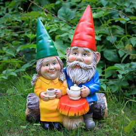 Smadeer garden gnome couple enjoying coffee on a log, a romantic outdoor centerpiece.