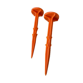Smart Spring low-profile stakes in orange for subtle boundary markers you can mow over.