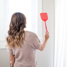 Smart Swatter hanging on a hook for easy storage