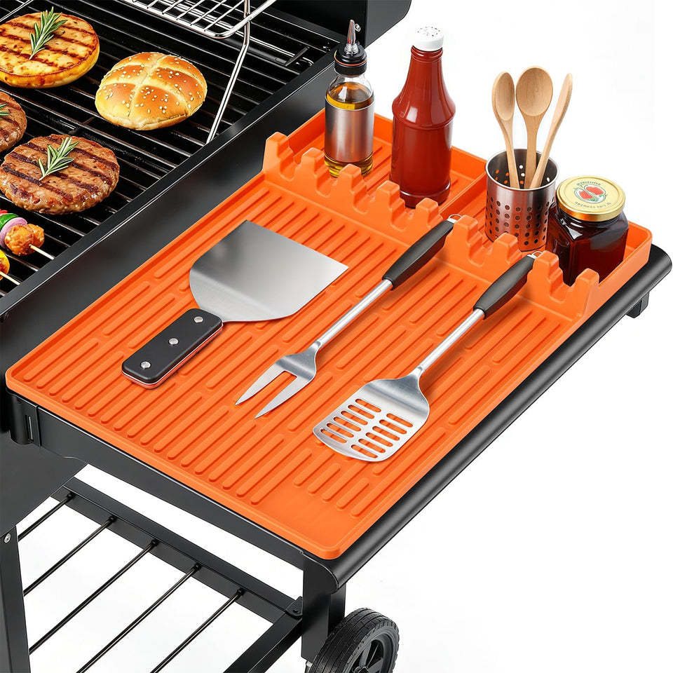 SmartKempt orange grill mat on side shelf keeps tools organized during grilling