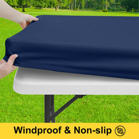 Smiry bench covers in navy protect seating during a sunny campsite.
