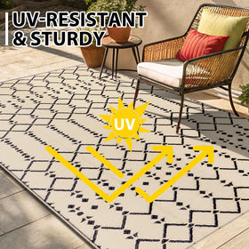 Smiry reversible rug showing double-sided options for outdoor vibes.