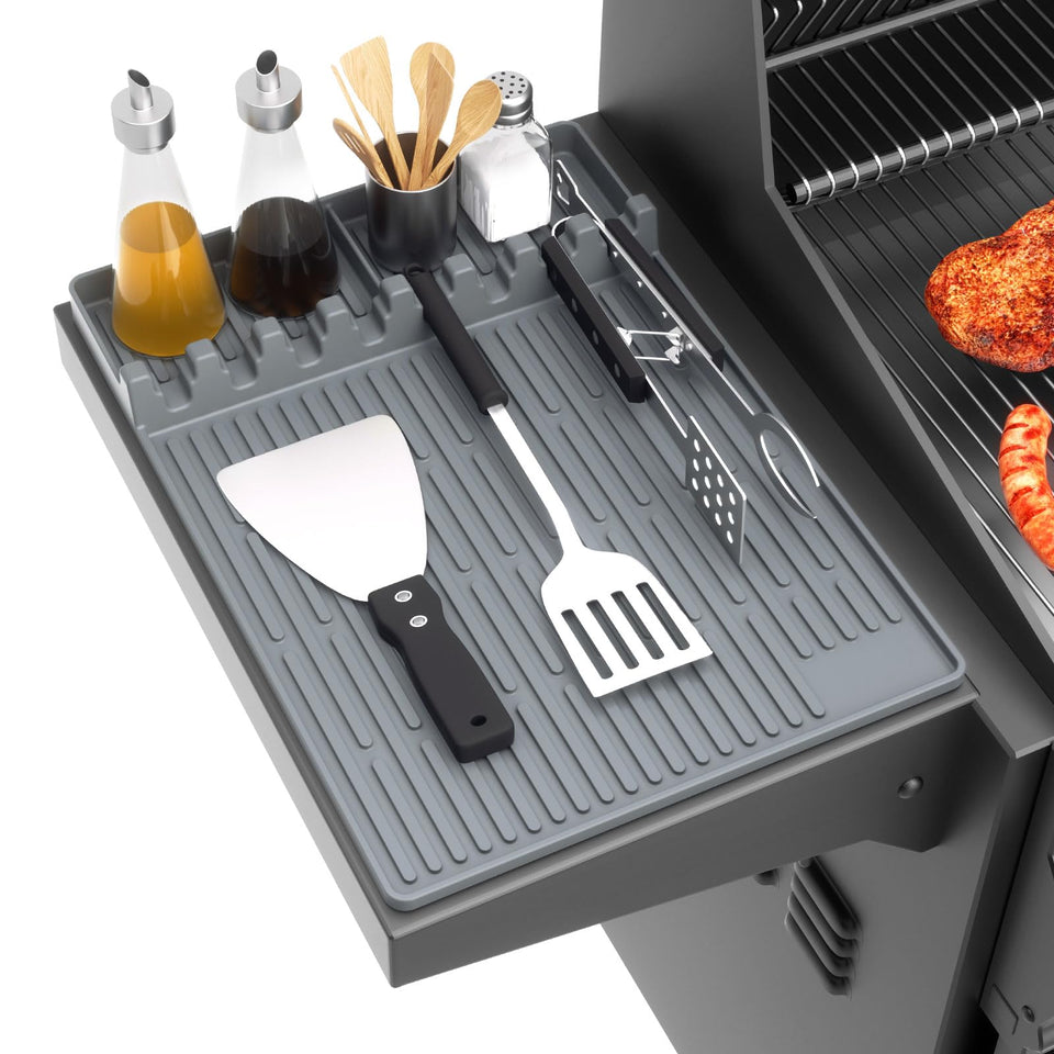 Snuggery silicone griddle tools mat on side shelf catching drips for cleaner cooking.