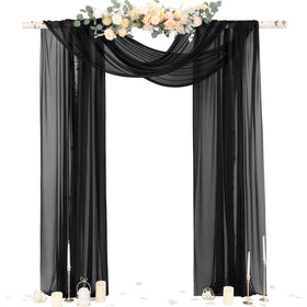 Socomi black sheer gothic wedding draping fabric forms elegant arch backdrop.