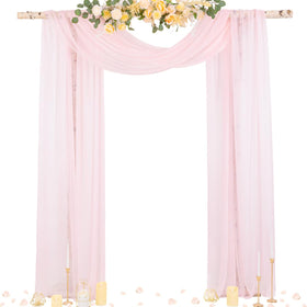 Socomi blush pink wedding arch drape panel over an arch, creating soft folds and elegant backdrop