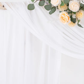 Socomi white sheer fabric drape hangs to the floor for photography ready elegance.