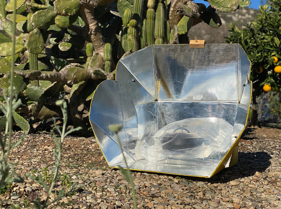 SOL COOK folded solar cooker for compact travel and easy storage.
