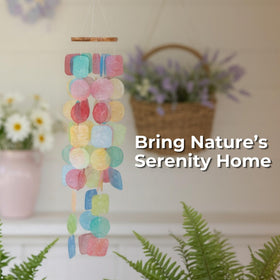 Solange and Frances capiz shell wind chimes brighten the porch with delicate sound.