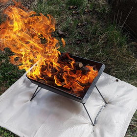 Edge holes on SoloWilder Fire Pit Mat for secure anchoring against wind