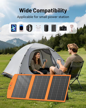SOLUPUP solar charging beside a tent at sunset.