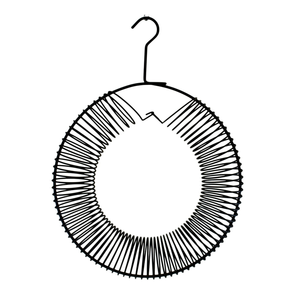 Songbird Essentials wreath feeder close-up shows easy access to unsalted peanuts for birds.