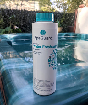 SpaGuard Water Freshener being poured to refresh spa water without affecting pH.