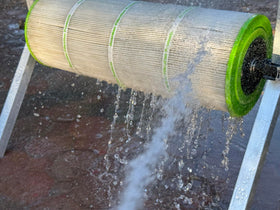 SpinDoc Pro Cleaning Stand attached to filter demonstrates on-site cleaning capability.