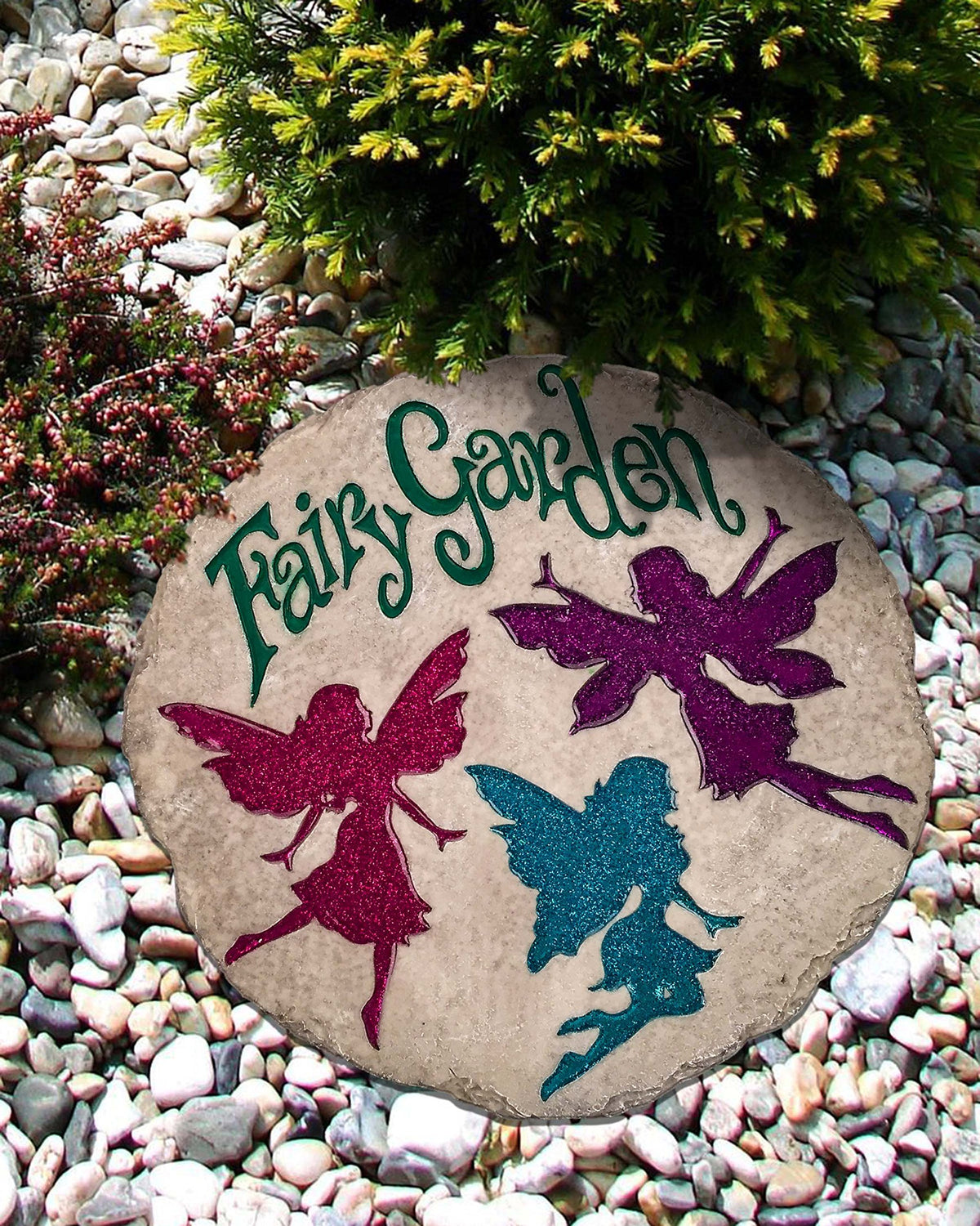 Spoontiques Scatter Kindness stepping stone displayed in a backyard border.