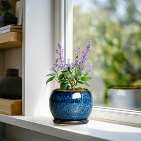 Close-up of SQOWL blue ceramic pot glaze and smooth finish