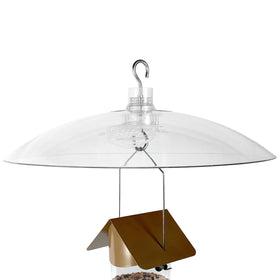 Squirrel Shield Clear 16 Inch Dome seen above a feeder, protecting seeds from rain.