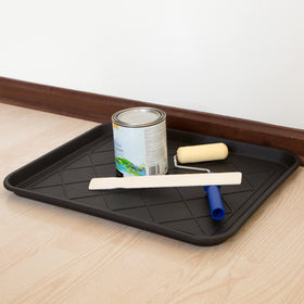 Stalwart boot tray in black complements any space and hides grime.