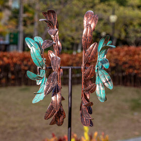 Stargarden wind spinner yard art catching sunlight and shadows