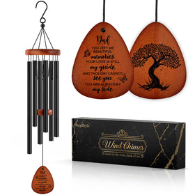 SteadStyle memorial wind chimes outdoors in a garden for remembrance and serenity.