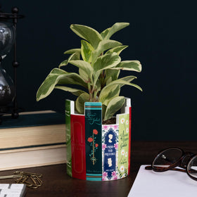 Steel Mill & Co ceramic desk pot on a bedroom table with plants.