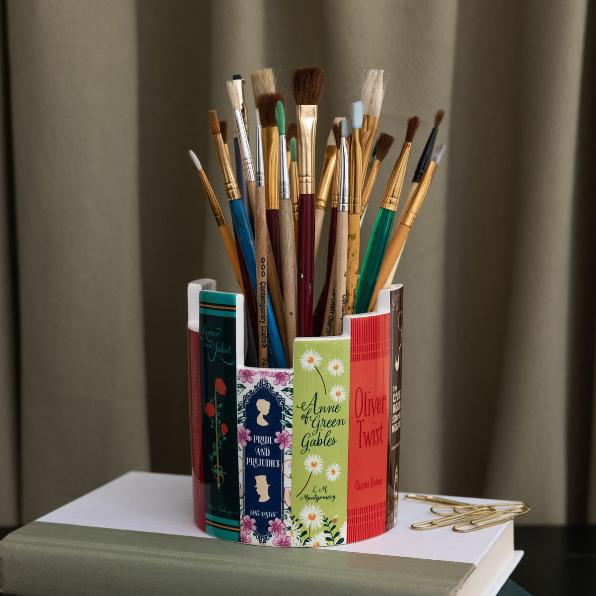Steel Mill & Co ceramic desk pot on a busy office shelf setup.
