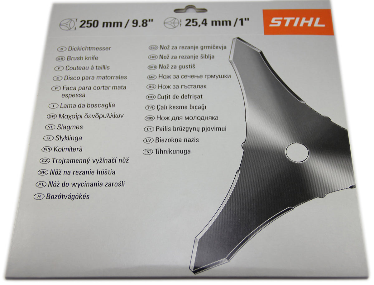 Stihl brush knife steel blade in use against dense brush and saplings.