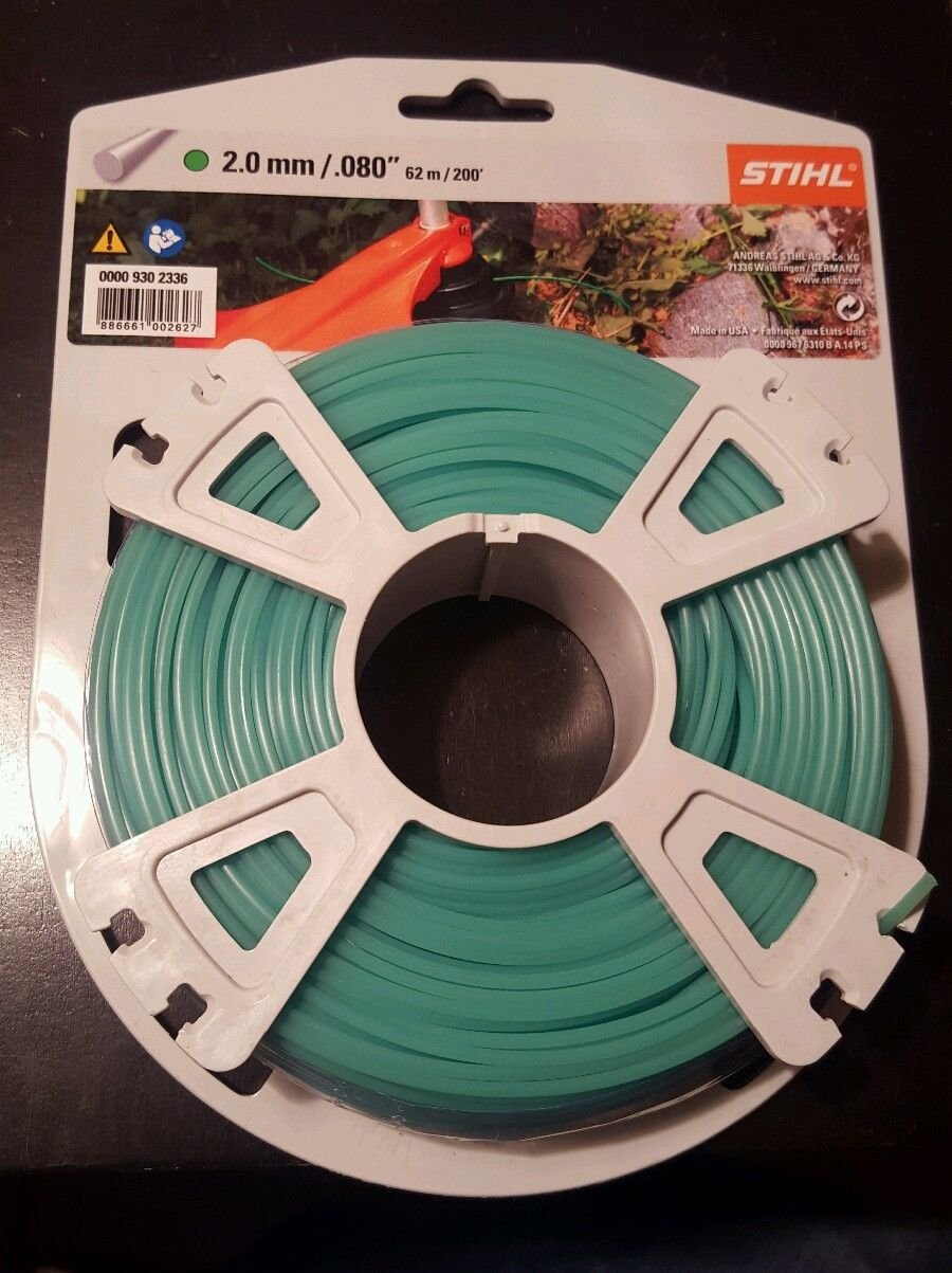 Stihl green mowing line in use promotes clean edge work.