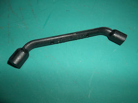 Stihl piston stop tool placed in spark plug port to lock the engine during maintenance