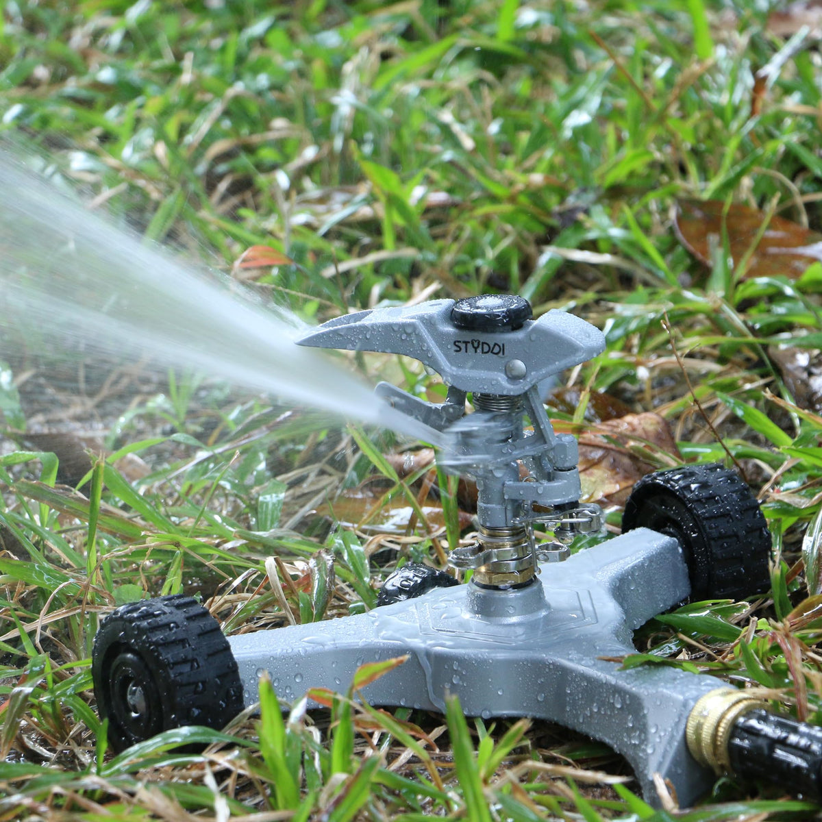 STYDDI sprinkler with 360-degree adjustable spray pattern for full yard coverage.