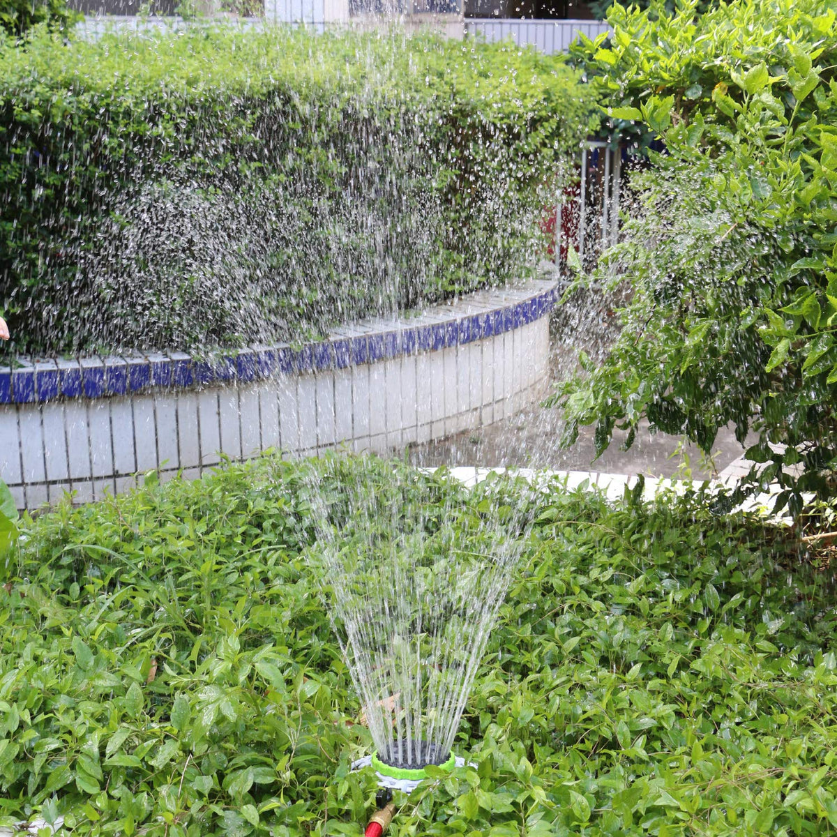 STYDDI sprinkler on metal base provides stable watering even on uneven ground