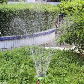 STYDDI sprinkler on metal base provides stable watering even on uneven ground