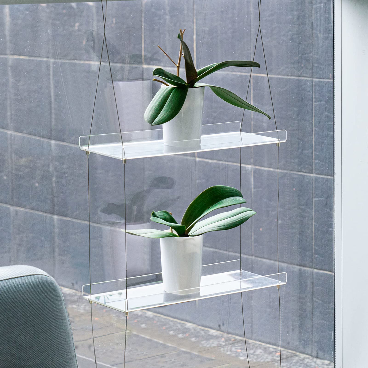 Sumerflos double-layer window shelf creates a compact herb garden.