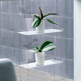 Sumerflos double-layer window shelf creates a compact herb garden.