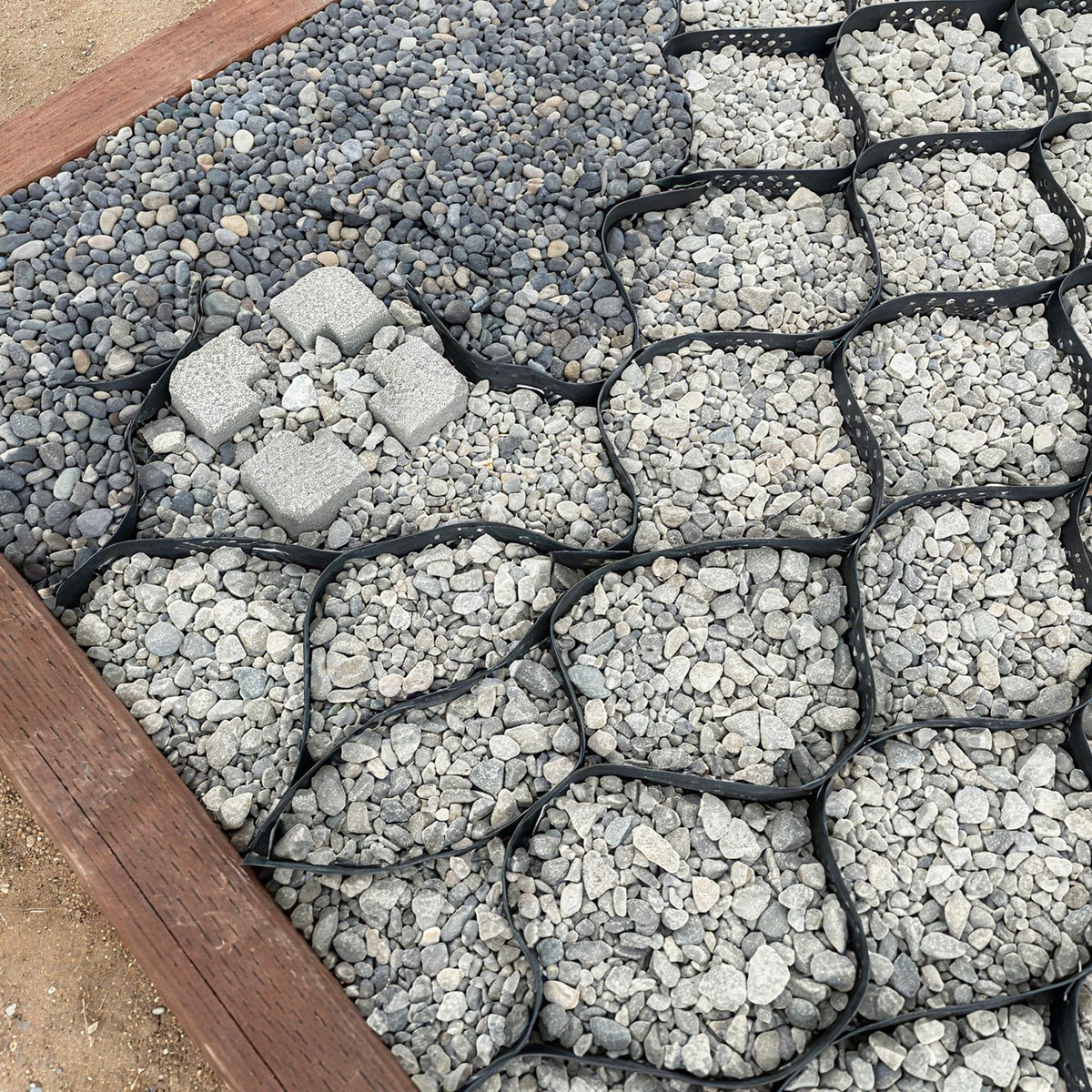Sumloty Gravel Grid adjustable and cut to fit irregular spaces.