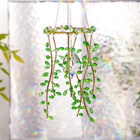 Suncalla three-piece suncatchers brighten kitchen window with color and light.