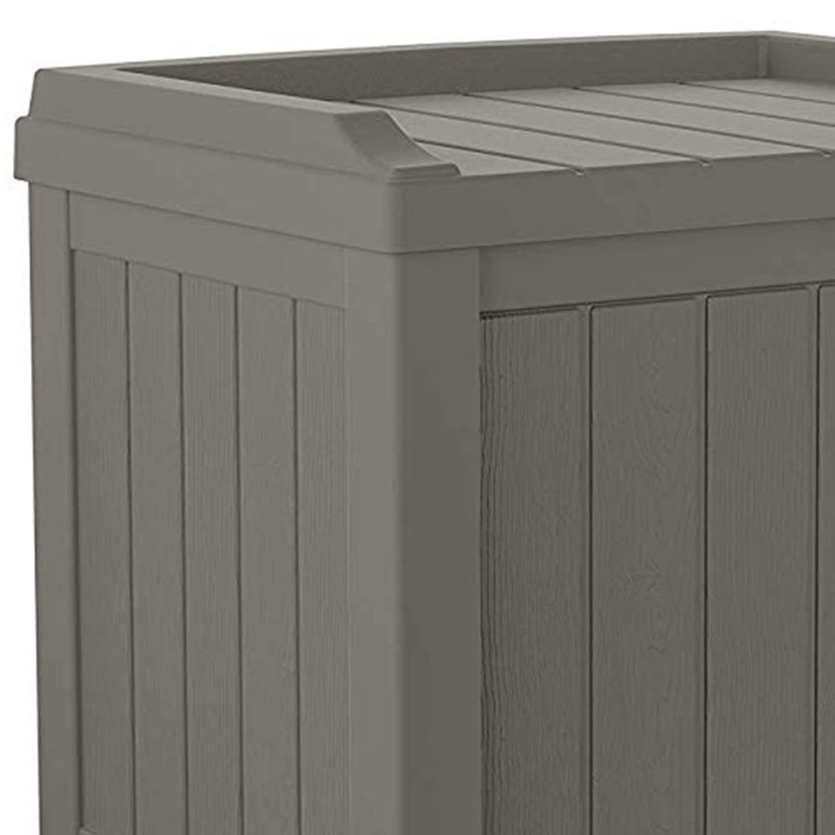 Suncast cushion and tool storage keeps garden tools and blankets organized.