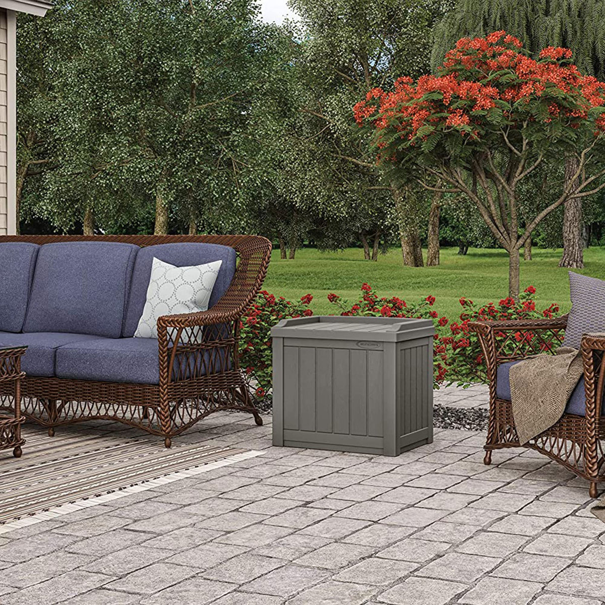Suncast rain-resistant storage box keeps contents dry outdoors.