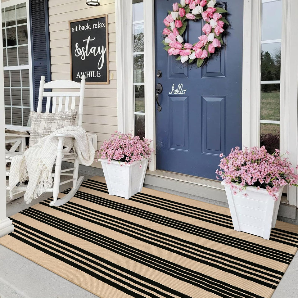 Sungea black and khaki striped door mat adds curb appeal and outdoor durability.
