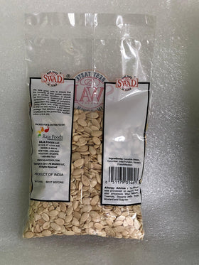 Swad Char Magaz melon seeds being spooned for a crunchy snack.