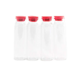 Sweet Feeders glass bottle on fridge for fresh nectar storage.