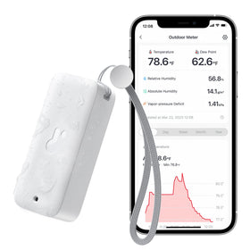 SwitchBot IP65 hygrometer-thermometer outdoors shows humidity and temperature for garden care