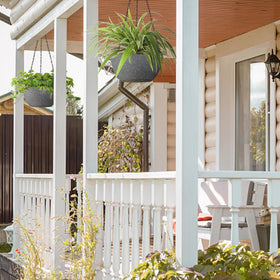 T4U speckled grey pot on balcony creates a cozy plant display.