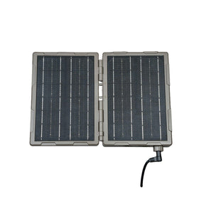 TACTACAM Reveal folding panel front view powering a trail camera in the field